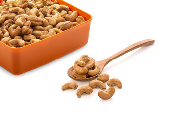 Cashew nuts in a Wooden spoon on white background