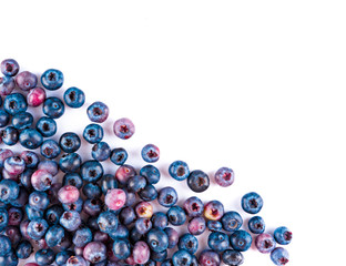 Fresh blueberries and leaves, berry frame isolated on white background, top view