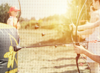 man shoots with arrow