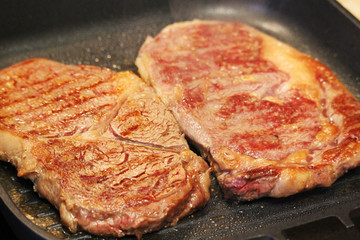 Two steaks cooked on the pan