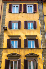 Typical windows of Florence architecture in monumental building. Florence, Italy