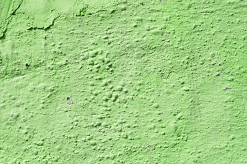 Surface of peeling paint, cracked plaster. Green colour