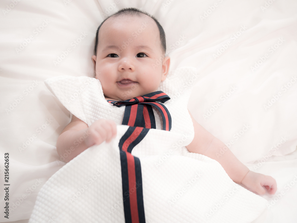 Wall mural happy and smile asian baby girl wearing white dress. 3 months baby.