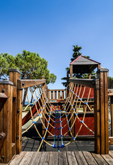 Fototapeta na wymiar Outdoor adventure playground for kids overlooking beautiful Lake Garda in Lombardy Italy