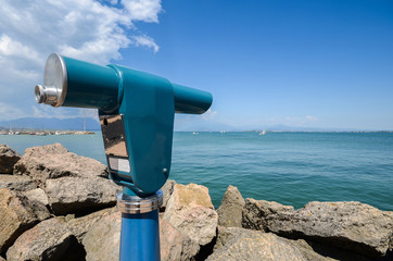 Viewing telescope monocular overlooking Lake Garda in Lombardy, Italy