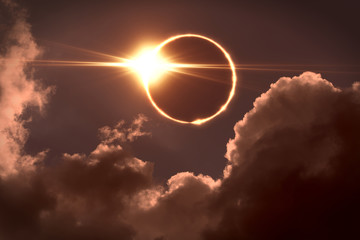 Total eclipse of the Sun. The moon covers the sun in a solar eclipse - obrazy, fototapety, plakaty