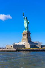 The statue of Liberty at a sunny day with blue sky, New York City, USA