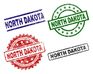 NORTH DAKOTA seal imprints with damaged texture. Black, green,red,blue vector rubber prints of NORTH DAKOTA text with dust texture. Rubber seals with round, rectangle, medallion shapes.