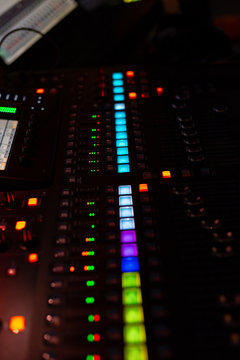 mixing console with blurred look live on stage