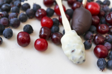 Chocolate candies and berries