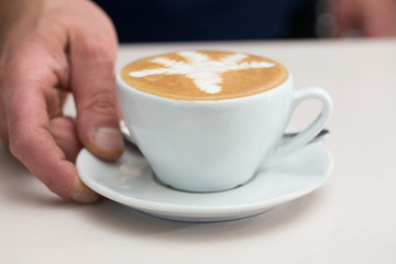 frontal serving cappuccino
