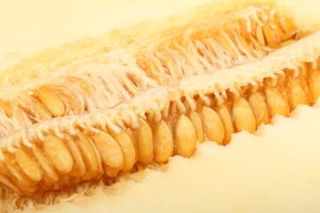 A view of a ripe melon with seeds cut in half close-up