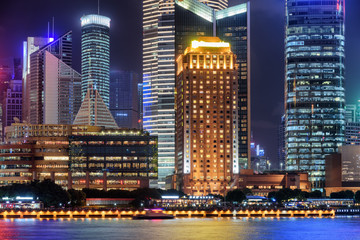 Fototapeta na wymiar Colorful night view of glowing modern buildings, Shanghai, China