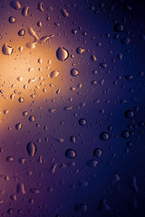 Water drops background.View through the window of strong rainy day ,Shallow depth of field composition and color toned.