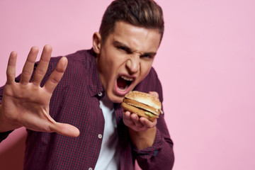 man burger on pink background