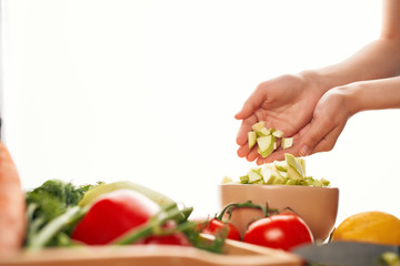 woman cutting vegetables in the kitchen