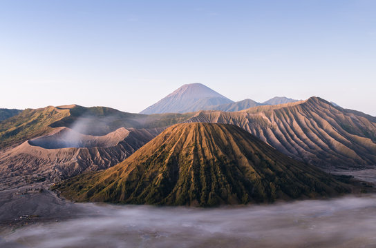 Beautiful mountain, wild desert, and cloudy mist in morning at java island Indonesia, bromo batok and sumeru