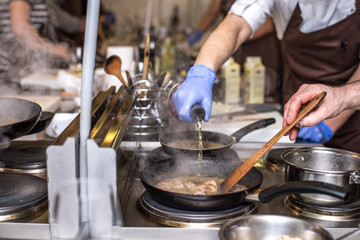 Chef in the kitchen cooking