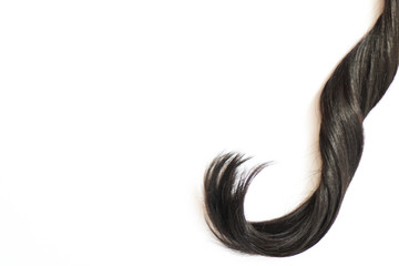 Close up on lock of black hair, free copy space