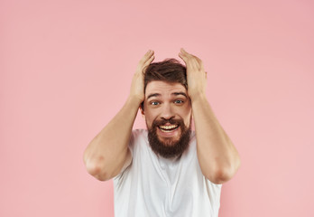 joyful man holding his head