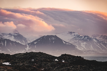 Typical Icelandic sunrise sunset mountain landscape at Arnarstapi area in Snaefellsnes peninsula in Iceland
