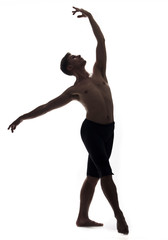 one young man, shirtless topless, ballet dancer, studio shot, white background isolated. full lenght shot, arms hand raised up, standing posing, looking up. © HD92