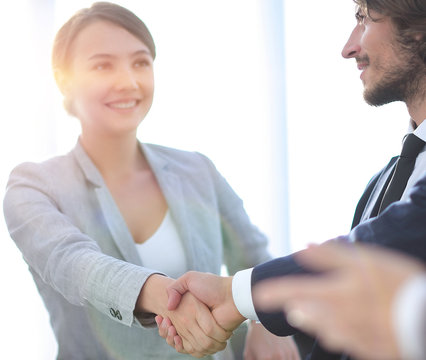 handshake business partners for their Desk