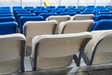 Empty white and blue stadium seats