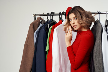 woman in dressing room choosing clothes