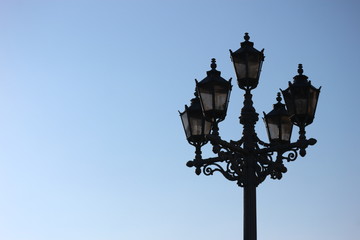 Beautiful old lantern on blue sky background, Saint Petersburg, Russia