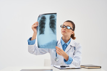 doctor looks x-ray