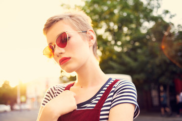 woman with glasses street sun