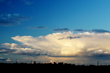 Naklejka premium Clouds in the sky over the city - Skyline