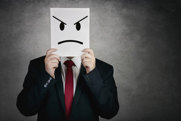 angry man with white board on gray background