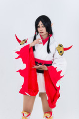 Portrait of beautiful asian girl wear cosplay game animation on white background,Thailand people,Red cloths devil style
