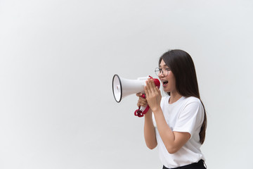 Beautiful asian woman with speaker in hand on white background,angry woman concept,Thailand people