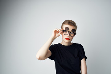 woman in glasses in black t-shirt