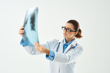 female doctor looking at x-ray