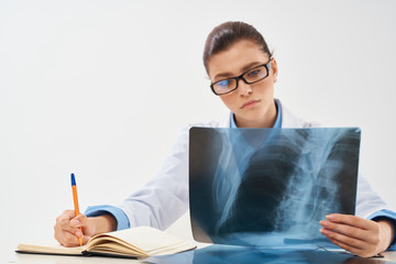 doctor with x-ray is working in the clinic