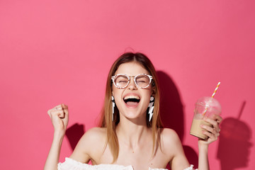 woman girl with earrings smiling over pink background