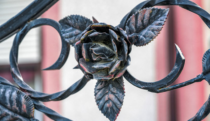 Beautiful forged rose from metal closeup