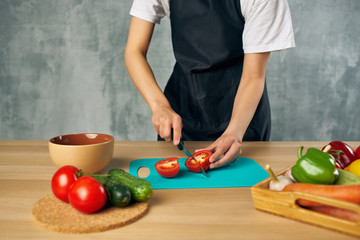 woman cutting vegetables in the kitchen