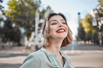 woman smiling in summer street park