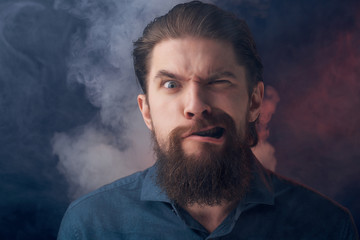 man with a beard smoke