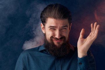 man with colored smoke beard
