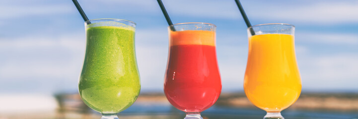Vegatable green juice drinks organic cold pressed juices selection. Spinach, beet and carrot glasses at cafe banner panorama.