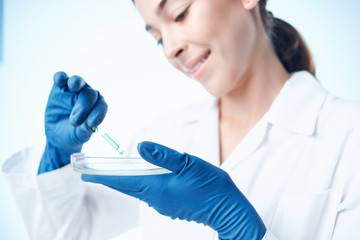 Fototapeta premium laboratory assistant with a petri dish experiments chemistry chemistry