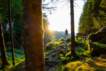 Man watching the sundown at Kossdalsvegen on the island of  Osterøy in Norway