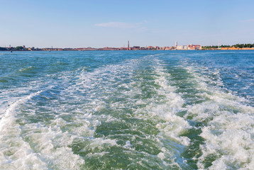 A trace from the boat, the ship. Venice is visible on the horizon