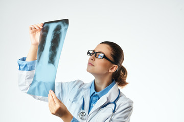 doctor looks at x-ray